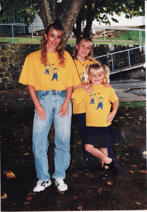 Linda Adamson, Jamie Adamson and Tessa Adamson wearing Love to Sing Yellow Tshirts